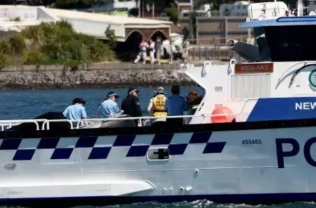 Me, standing in a police boat wearing a life jacket that says "No New Coal" hard to see but I'm joined by a student doctor, she's a true inspiration.