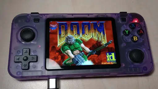 translucent purple handheld console displaying the doom loading screen