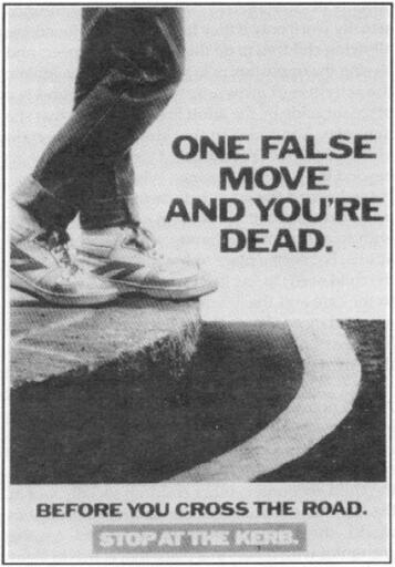 Photo of two legs of a person on the sidewalk close to the edge. Overlay writing: "one false move and you are dead". Another overlay: "before you cross the road, stop at the kerb". Public domain image: https://commons.wikimedia.org/wiki/File:Campain-_One_false_move_and_you%27re_dead.png