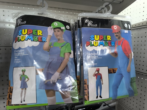 an image of two cheap party costumes, both labeled "Super Plumber" which are clearly based on Mario and Luigi with Mario being the men's option and Luigi being the women's. Luigi has a dress instead of overalls.